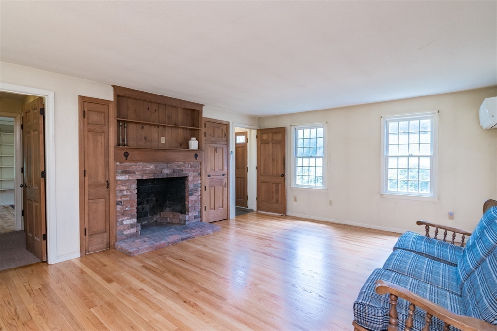 24 South Sunset Avenue Amherst, MA 01002 - Photo 8 of 42 a view of an empty room with wooden floor and a window