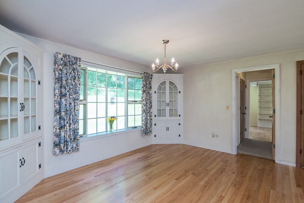 24 South Sunset Avenue Amherst, MA 01002 - Photo 10 of 42 a view of empty room with wooden floor and fan