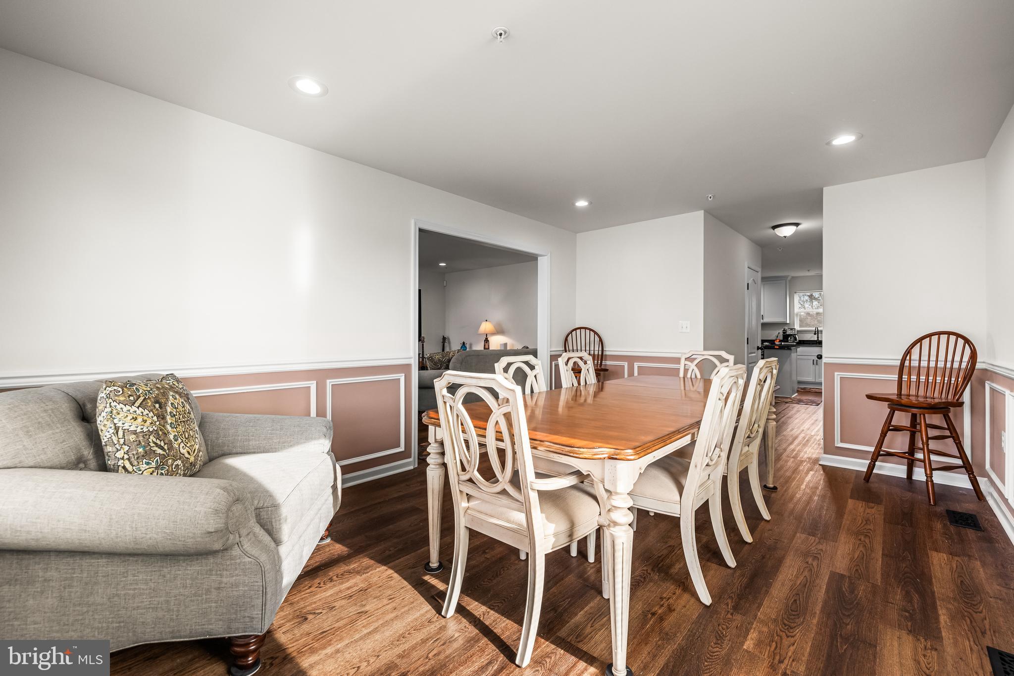 13107 Choptank Road Middle River, MD 21220 - Photo 11 of 42 a view of a dining room with furniture and wooden floor