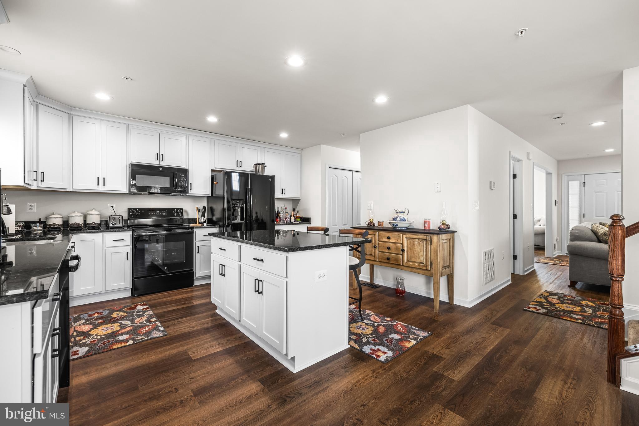 13107 Choptank Road Middle River, MD 21220 - Photo 16 of 42 a kitchen with a sink cabinets and wooden floor