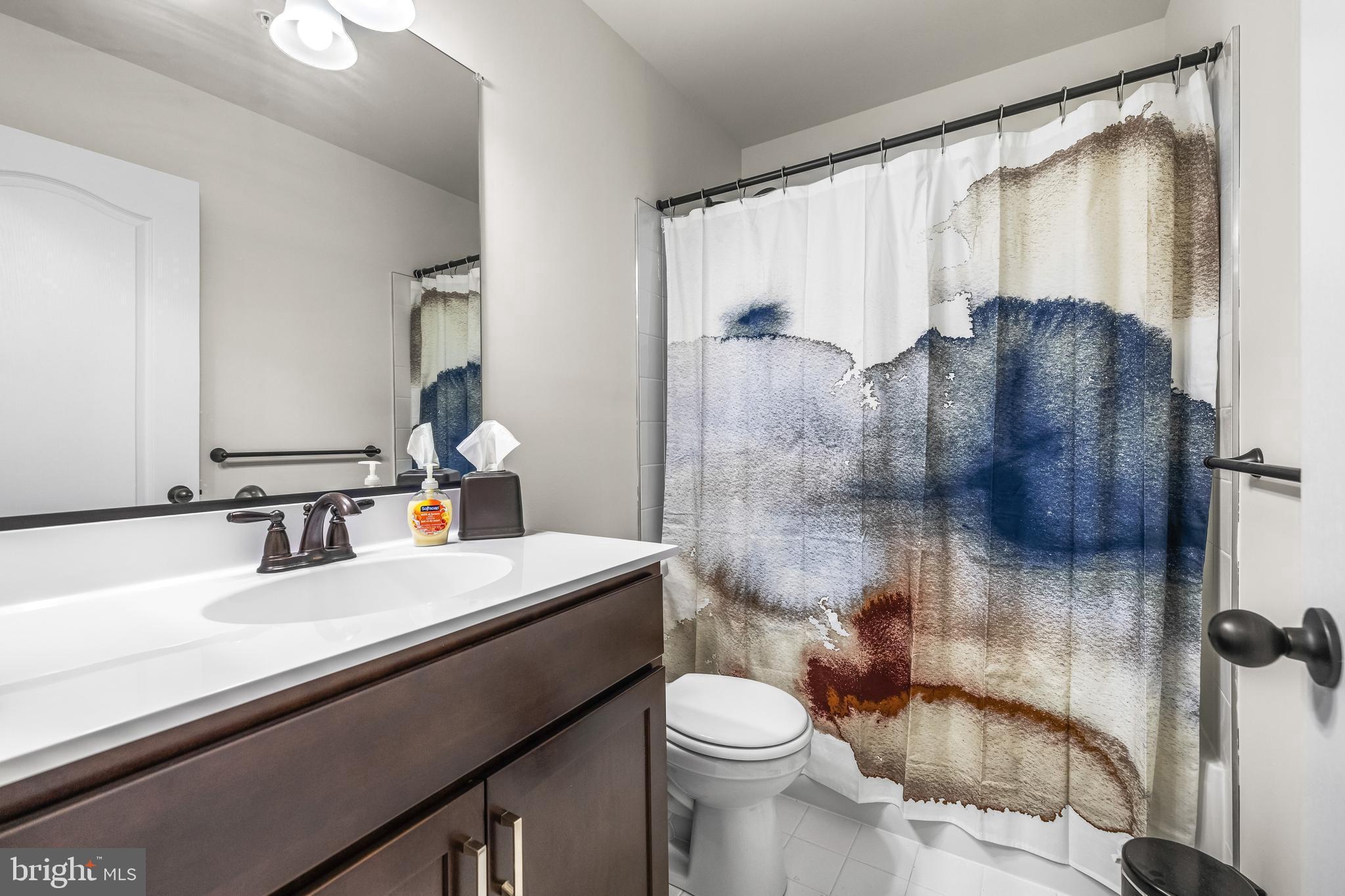 13107 Choptank Road Middle River, MD 21220 - Photo 23 of 42 a bathroom with a sink a toilet and shower