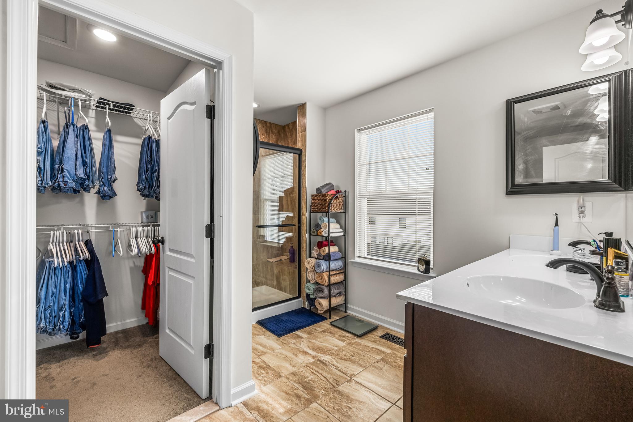 13107 Choptank Road Middle River, MD 21220 - Photo 32 of 42 a view of walk in closet with clothes and shoes
