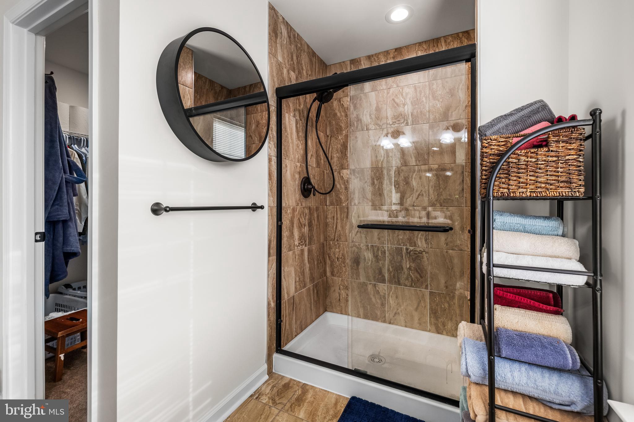 13107 Choptank Road Middle River, MD 21220 - Photo 34 of 42 a bathroom with a shower and a mirror