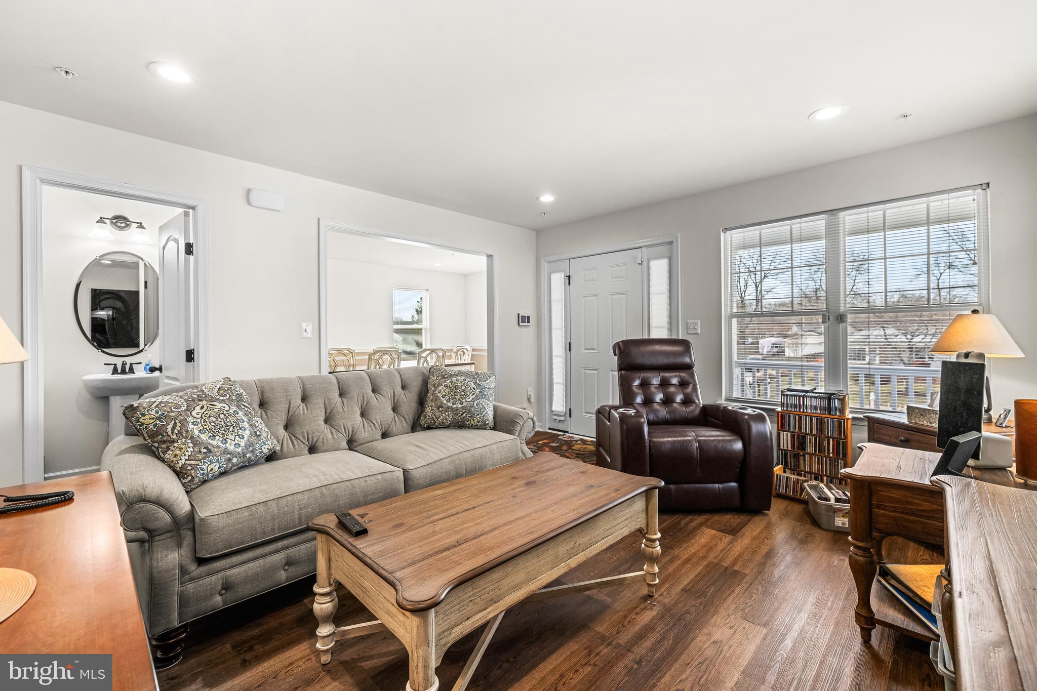 13107 Choptank Road Middle River, MD 21220 - Photo 6 of 42 a living room with furniture a flat screen tv and a window