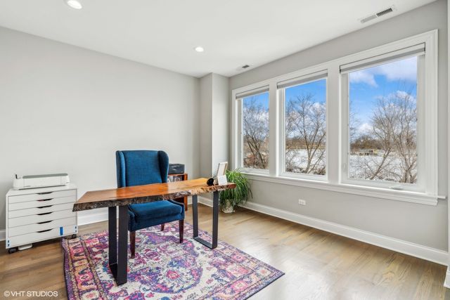 a work room with furniture and a window