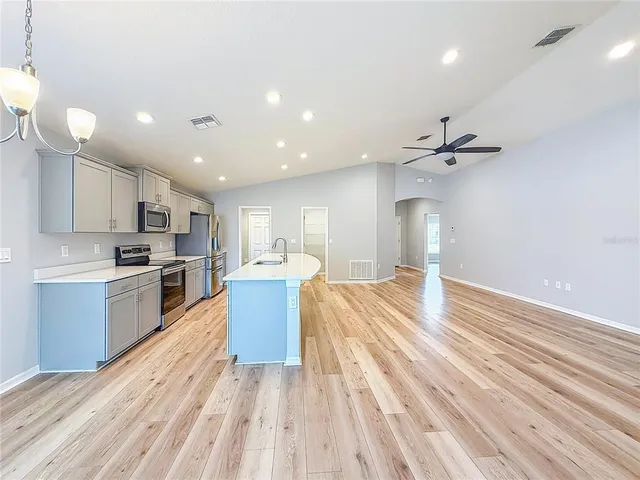 a spacious bathroom with a tub sink shower and mirror