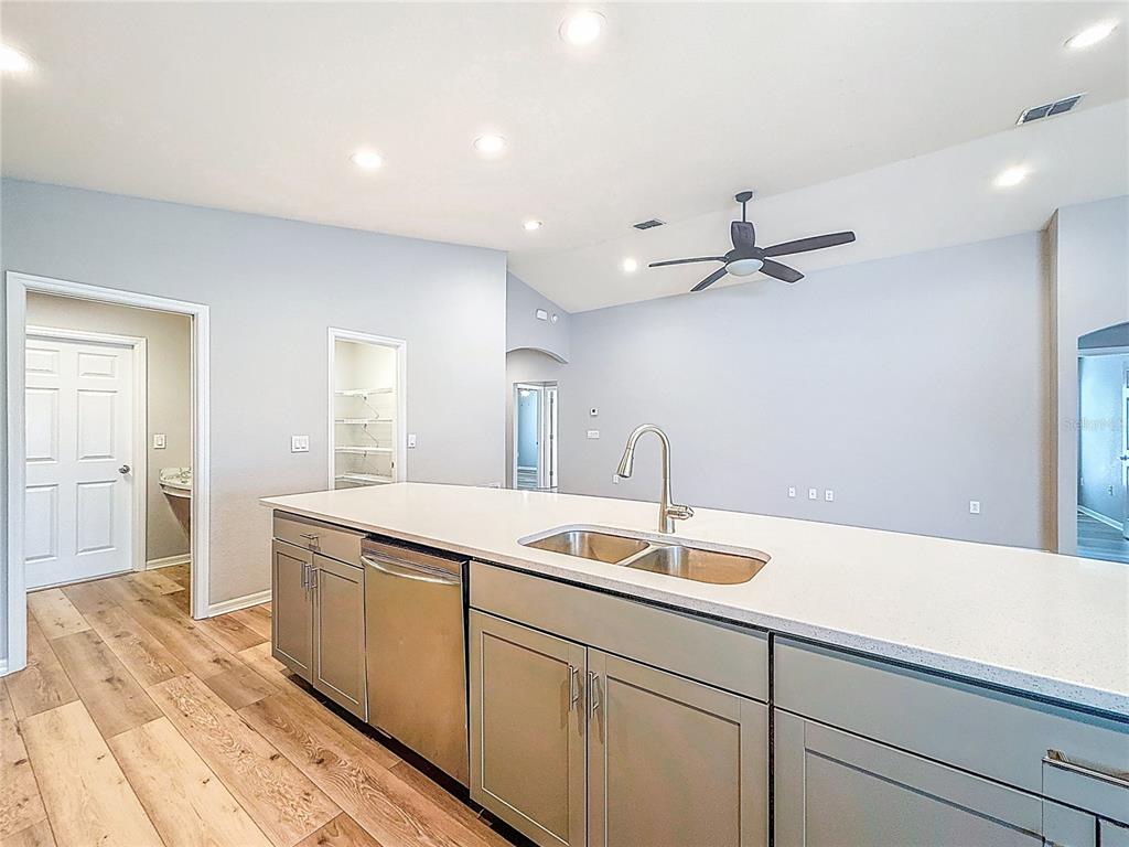 6945 Gideon Circle Zephyrhills, FL 33541 - Photo 19 of 45 a kitchen with a sink and cabinets