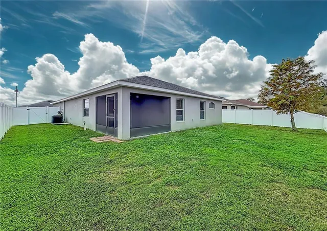 a large kitchen with stainless steel appliances lots of counter space and a sink