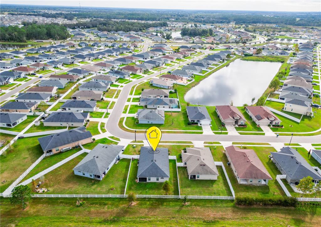 6945 Gideon Circle Zephyrhills, FL 33541 - Photo 10 of 45 an aerial view of residential houses with outdoor space and swimming pool