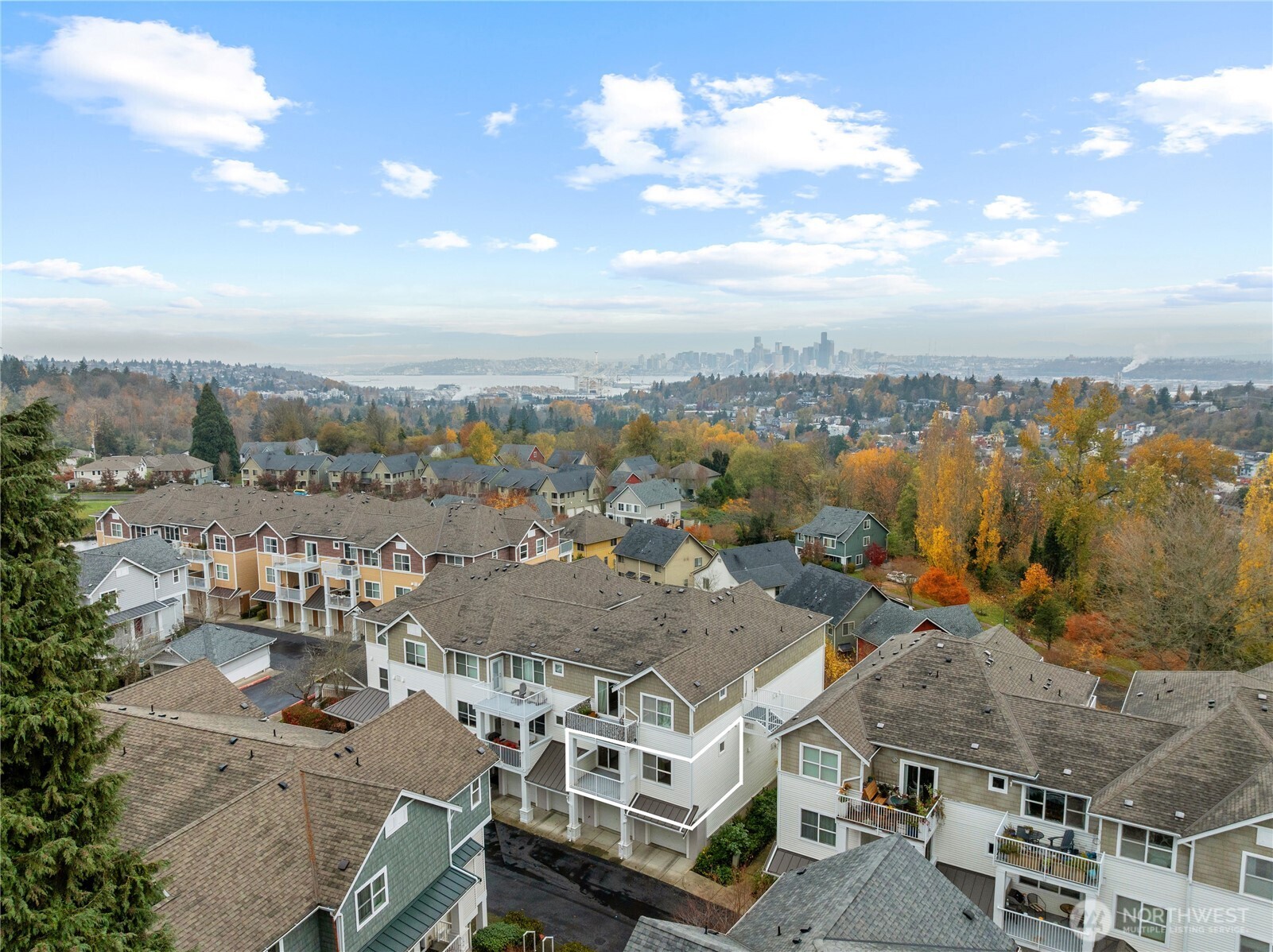 2840 Southwest Raymond Street, Unit 203 Seattle, WA 98126 - Photo 33 of 39 an aerial view of residential houses with outdoor space