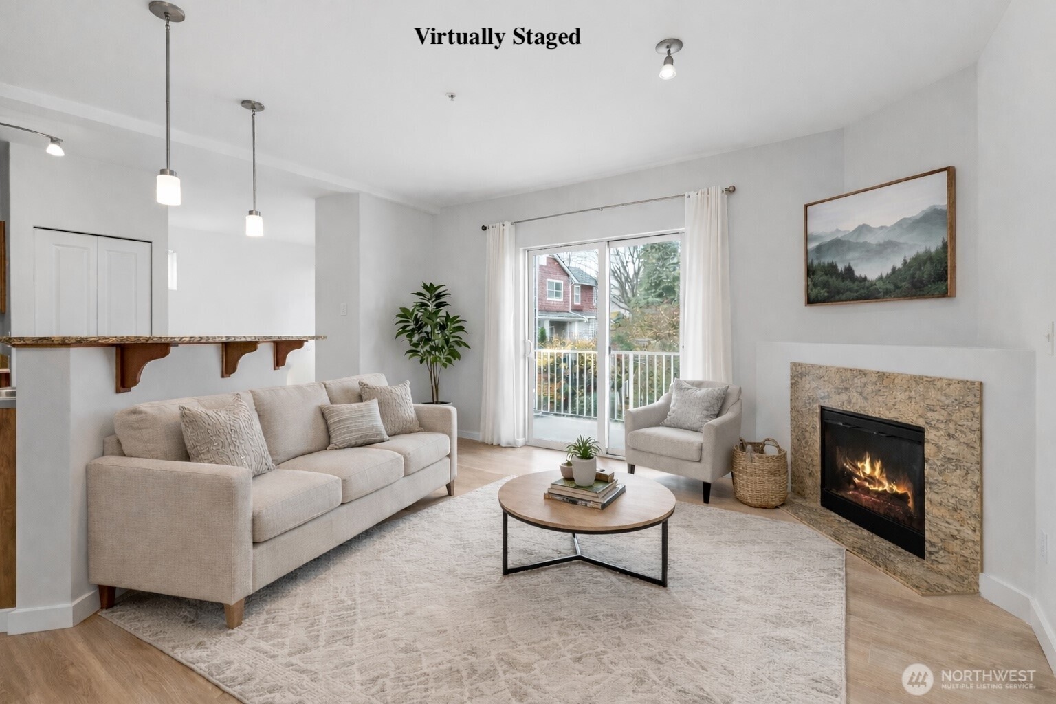 2840 Southwest Raymond Street, Unit 203 Seattle, WA 98126 - Photo 8 of 39 a living room with furniture and a fireplace