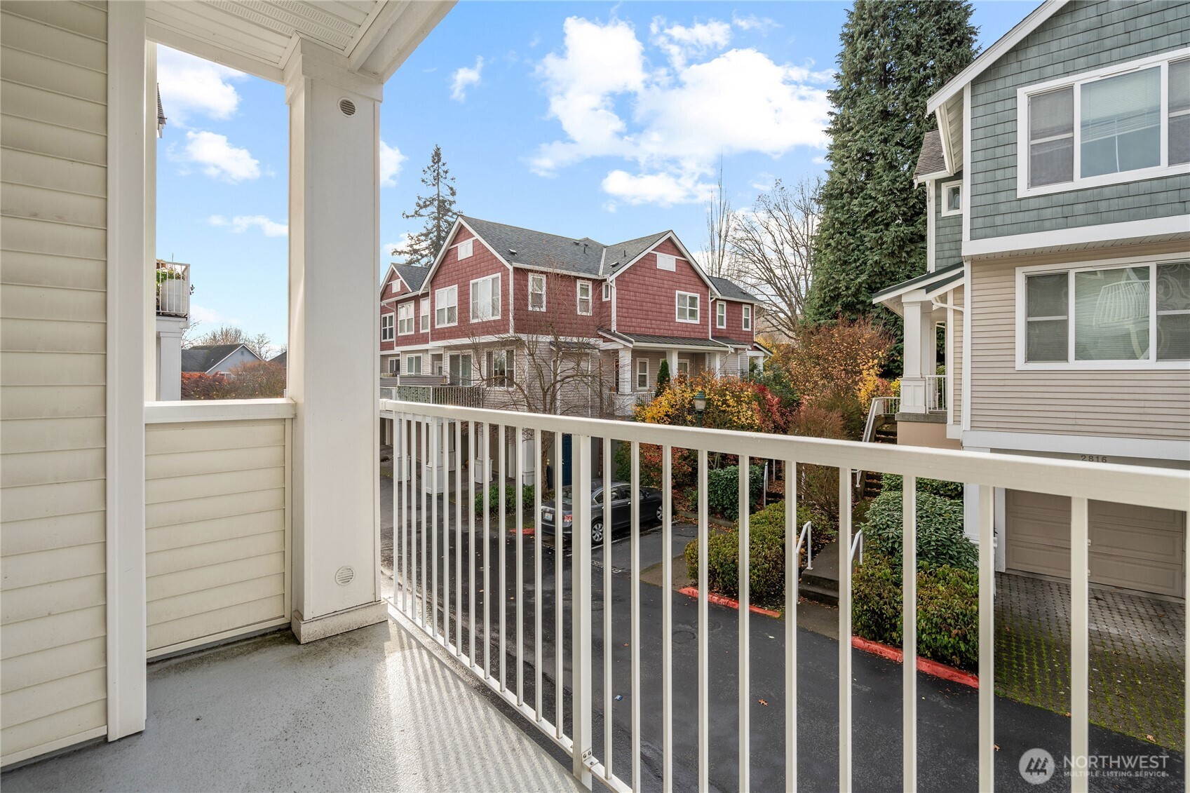 2840 Southwest Raymond Street, Unit 203 Seattle, WA 98126 - Photo 10 of 39 a view of a houses from a balcony
