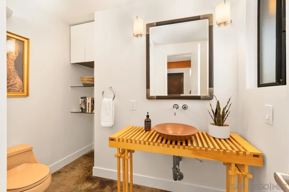 465 Glencrest Drive Solana Beach, CA 92075 - Photo 12 of 28 a bathroom with a sink and a mirror