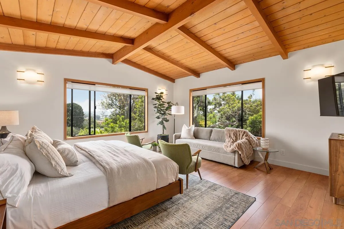 465 Glencrest Drive Solana Beach, CA 92075 - Photo 13 of 28 a large bedroom with a bed and large windows