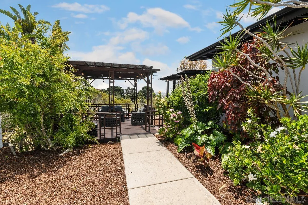 465 Glencrest Drive Solana Beach, CA 92075 - Photo 24 of 28 a view of a patio with table and chairs potted plants