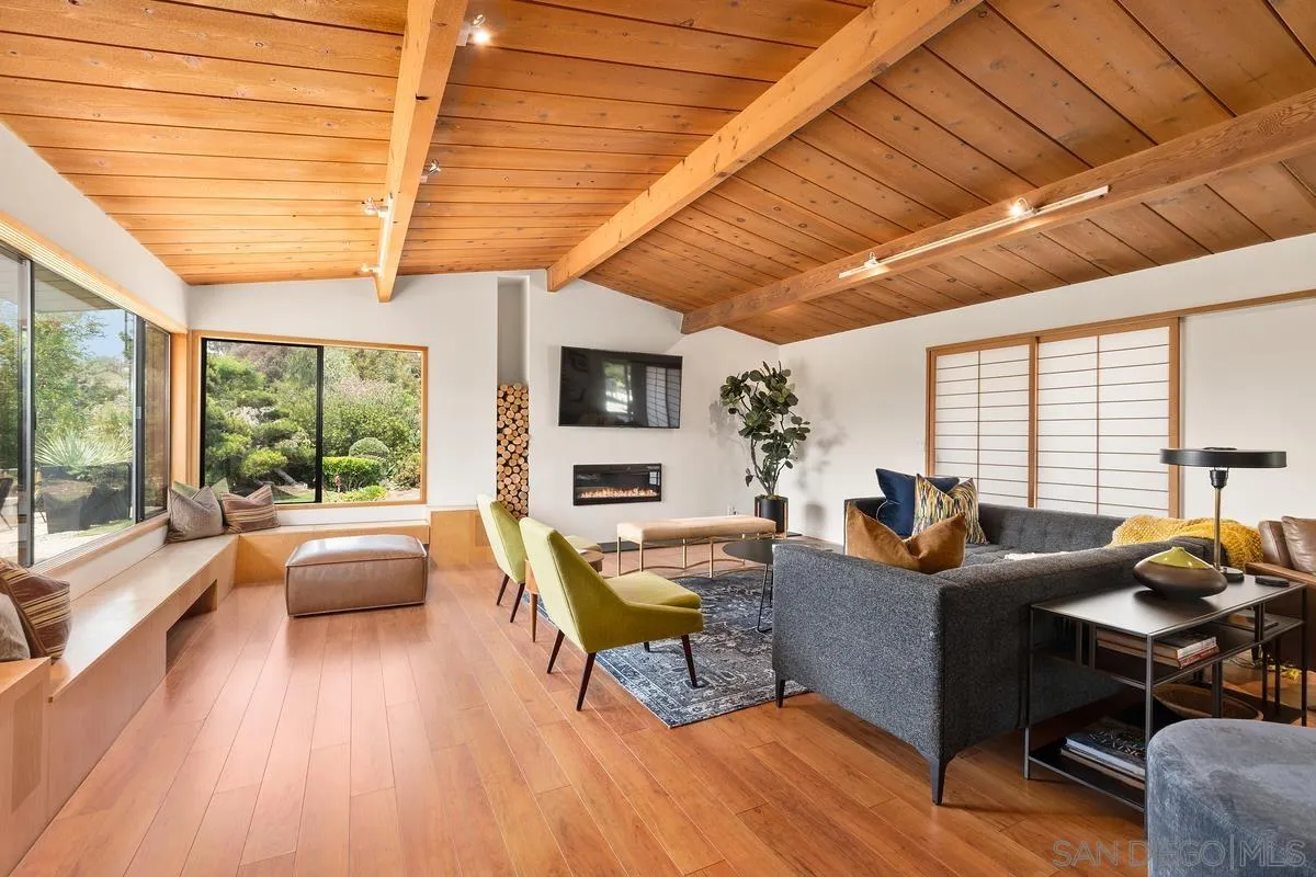 465 Glencrest Drive Solana Beach, CA 92075 - Photo 7 of 28 a living room with fireplace furniture and a large window