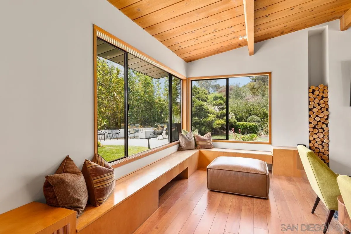 465 Glencrest Drive Solana Beach, CA 92075 - Photo 8 of 28 a living room with furniture and a large window with outer view