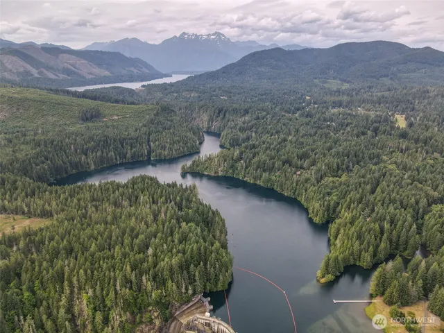 a view of a lush green hillside and a building