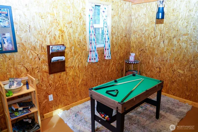 a room with a table and a painting on the wall