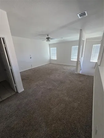 a view of empty room with windows