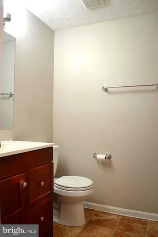 a bathroom with a toilet and a sink