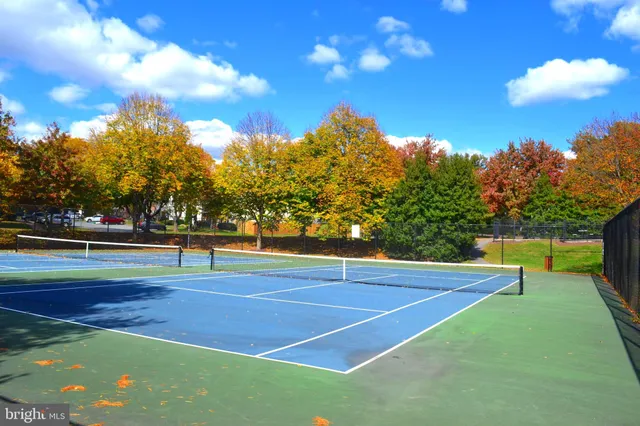 a view of an outdoor space and tennis court