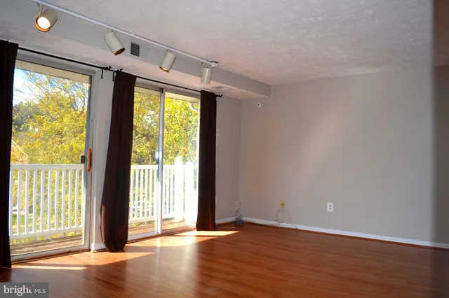 a view of entryway with wooden floor