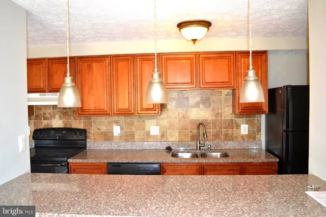 a kitchen with a window and a counter top space