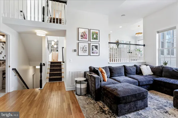 a bathroom with a sink and mirror with bathtub