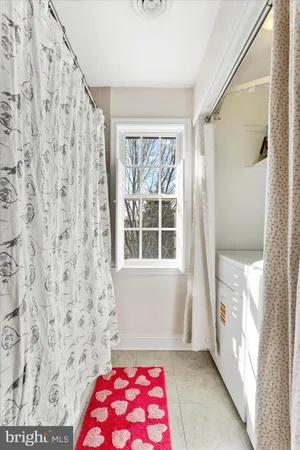 a bathroom with a glass shower door