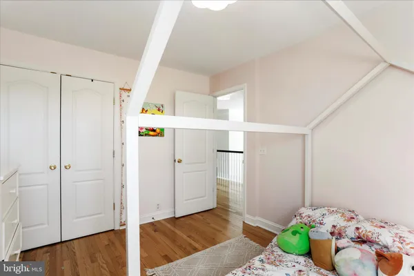 a bedroom that has a bed and a window in it