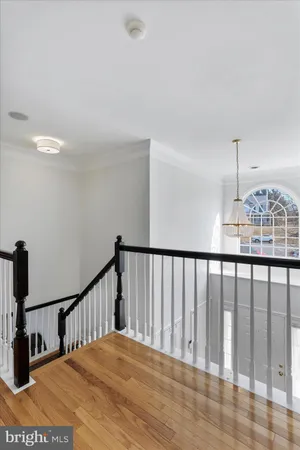 a view of hall way with furniture and staircase