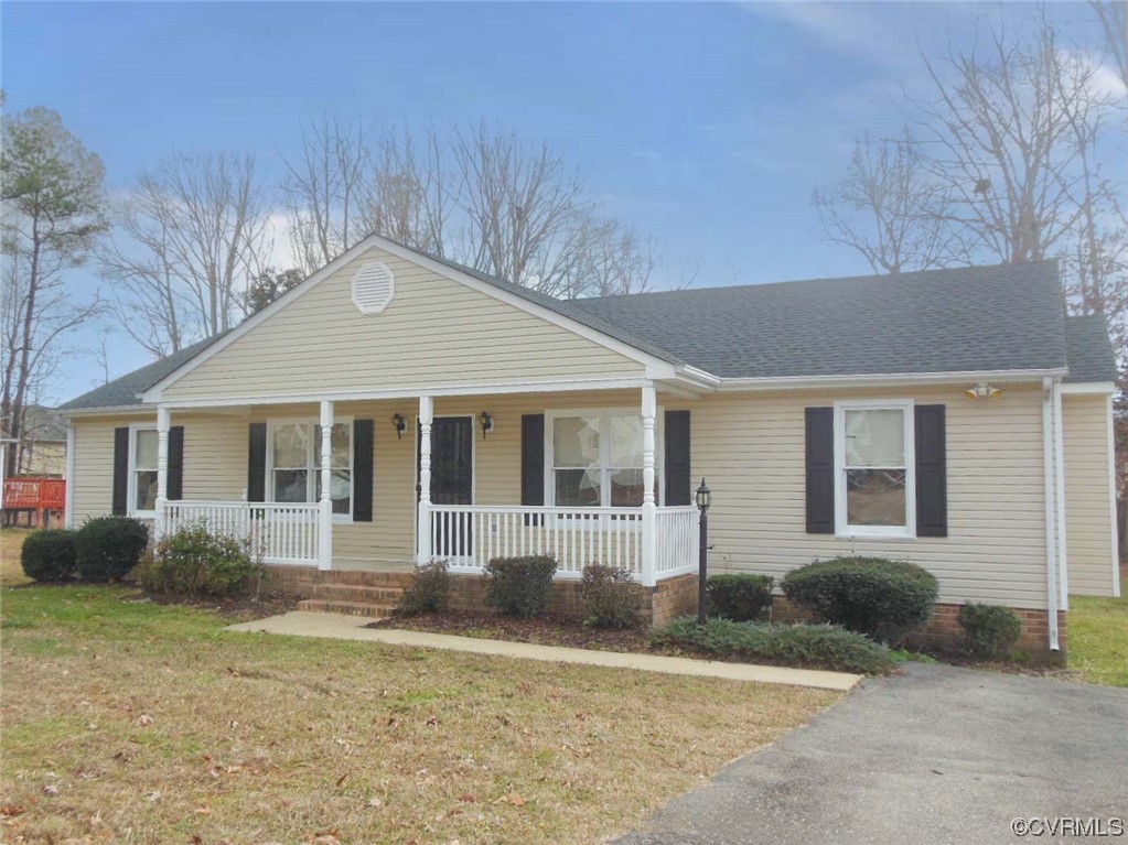 7447 Trailing Rock Road Prince George, VA 23875 - Photo 1 of 28 front view of a house with a yard