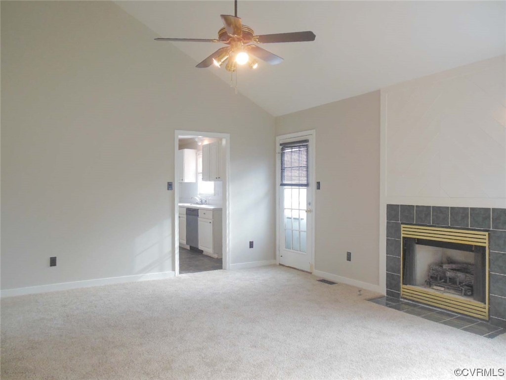 7447 Trailing Rock Road Prince George, VA 23875 - Photo 16 of 28 a view of empty room with fireplace and fan