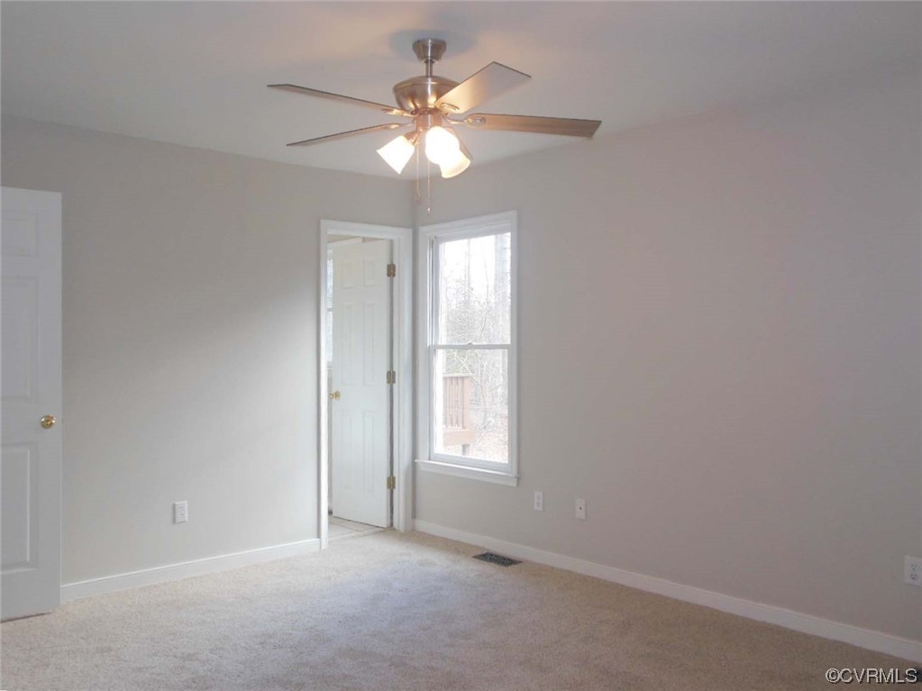 7447 Trailing Rock Road Prince George, VA 23875 - Photo 20 of 28 a view of an empty room with a window