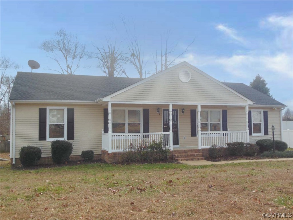 7447 Trailing Rock Road Prince George, VA 23875 - Photo 2 of 28 a front view of a house with garden