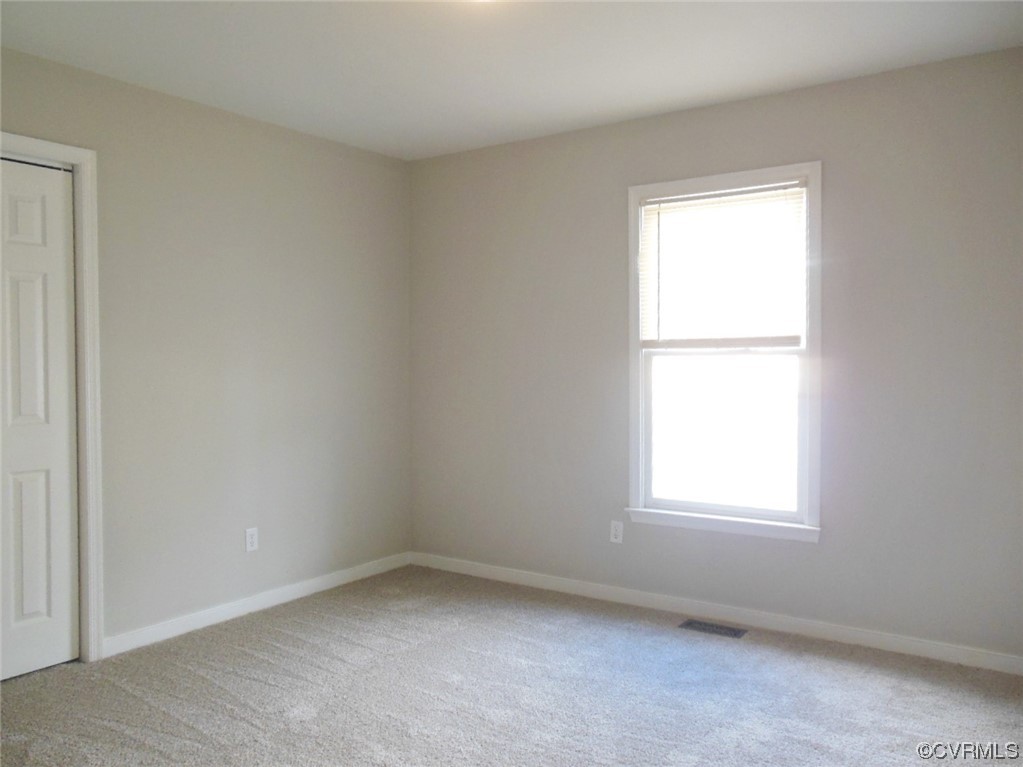 7447 Trailing Rock Road Prince George, VA 23875 - Photo 23 of 28 an empty room with a window