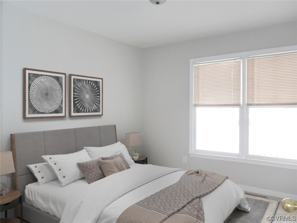 7447 Trailing Rock Road Prince George, VA 23875 - Photo 24 of 28 a bedroom with a bed and a window