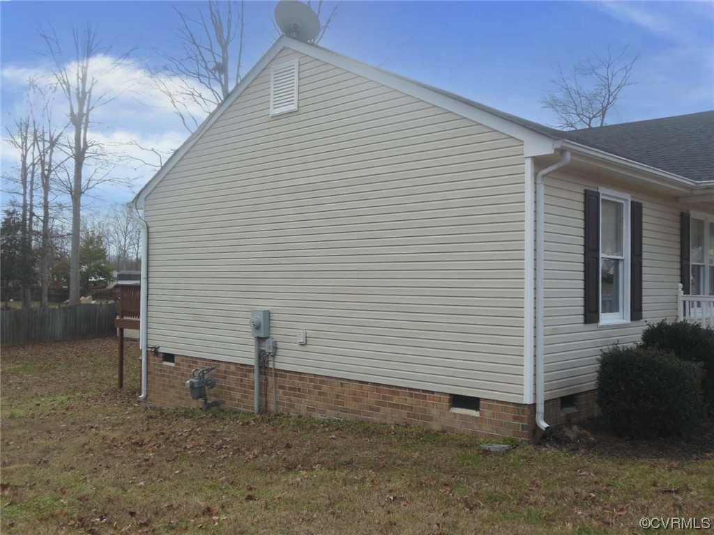 7447 Trailing Rock Road Prince George, VA 23875 - Photo 4 of 28 a view of a house with a backyard