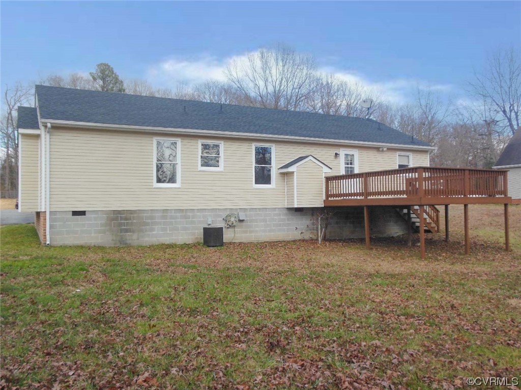 7447 Trailing Rock Road Prince George, VA 23875 - Photo 5 of 28 a backyard of a house with table and chairs