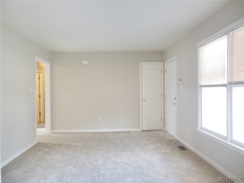 7447 Trailing Rock Road Prince George, VA 23875 - Photo 7 of 28 a view of an empty room with a window