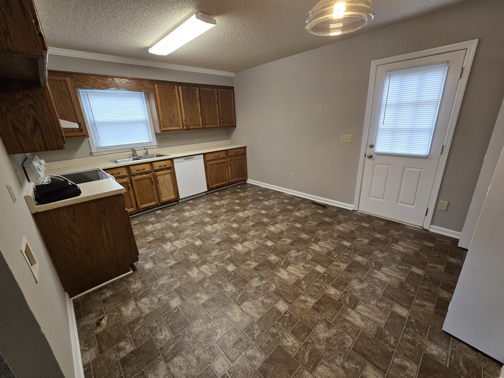 224 Hunter Drive Columbia, TN 38401 - Photo 6 of 13 a kitchen with granite countertop a stove a sink and a microwave