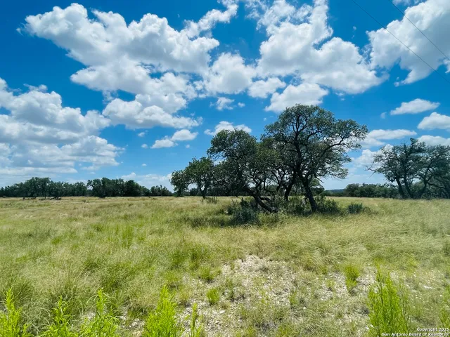 a view of a yard with an outdoor space and seating