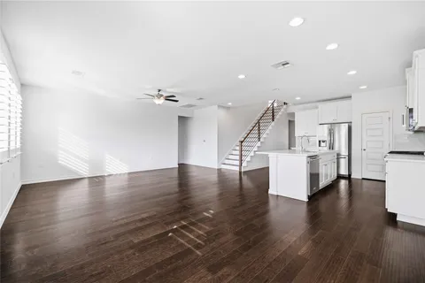 a view of kitchen with furniture and wooden floor