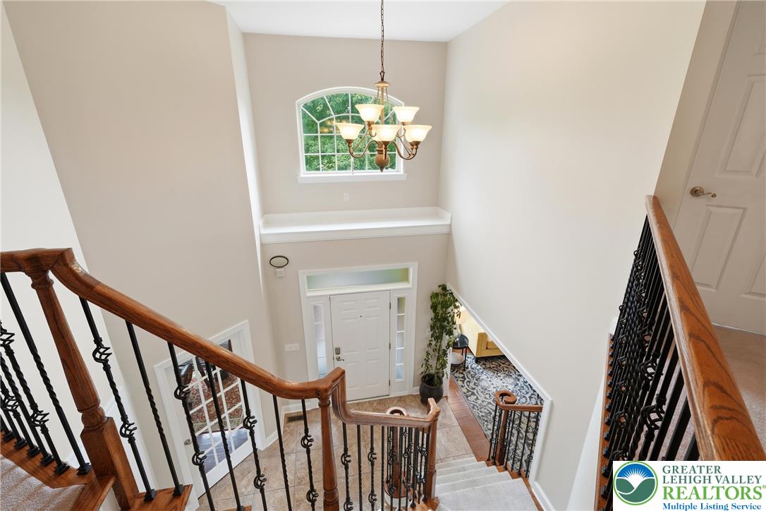 245 East Dell Road Bath, PA 18014 - Photo 32 of 99 Grand two-story foyer welcomes guests with soaring ceilings and an elegant chandelier.