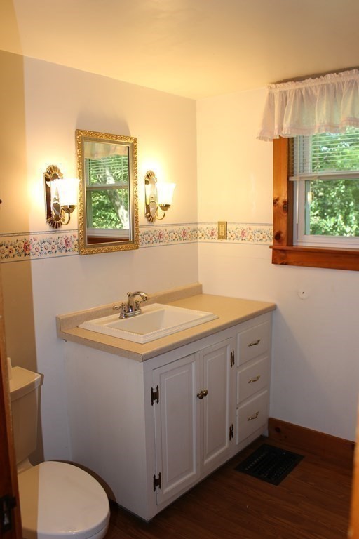 45 Orange Road Warwick, MA 01378 - Photo 6 of 11 a bathroom with a granite countertop sink and a toilet