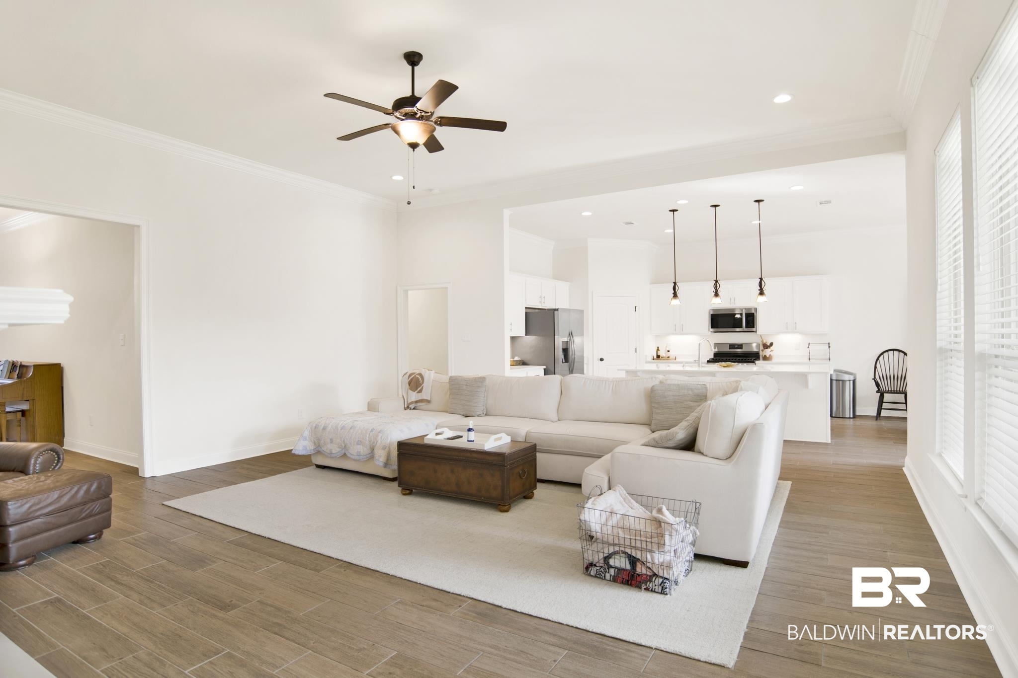 22258 Hibiscus Circle Foley, AL 36535 - Photo 11 of 26 Living area featuring a ceiling fan, recessed lighting, light wood-style floors, and ornamental molding