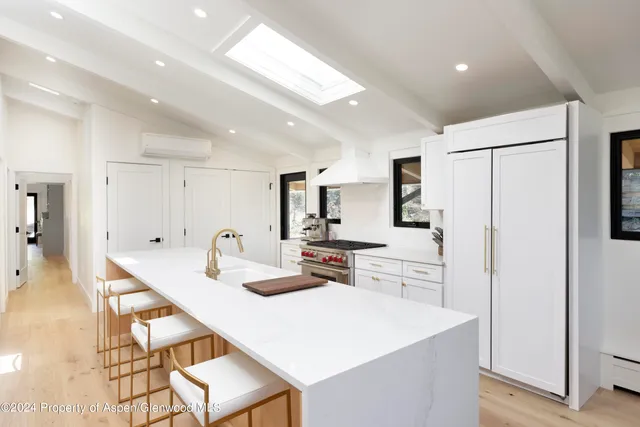 a view of a patio with a table and chairs