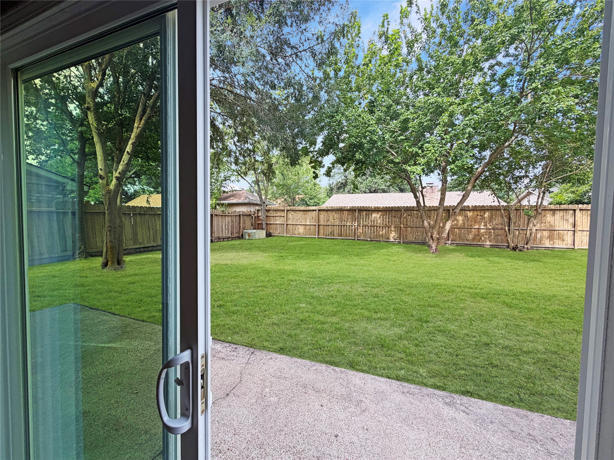 8407 Riverside Walk Lane Houston, TX 77064 - Photo 12 of 33 Step outside to your oversized, serene backyard with a spacious patio, perfect for morning coffee, weekend barbecues, or entertaining family and friends.