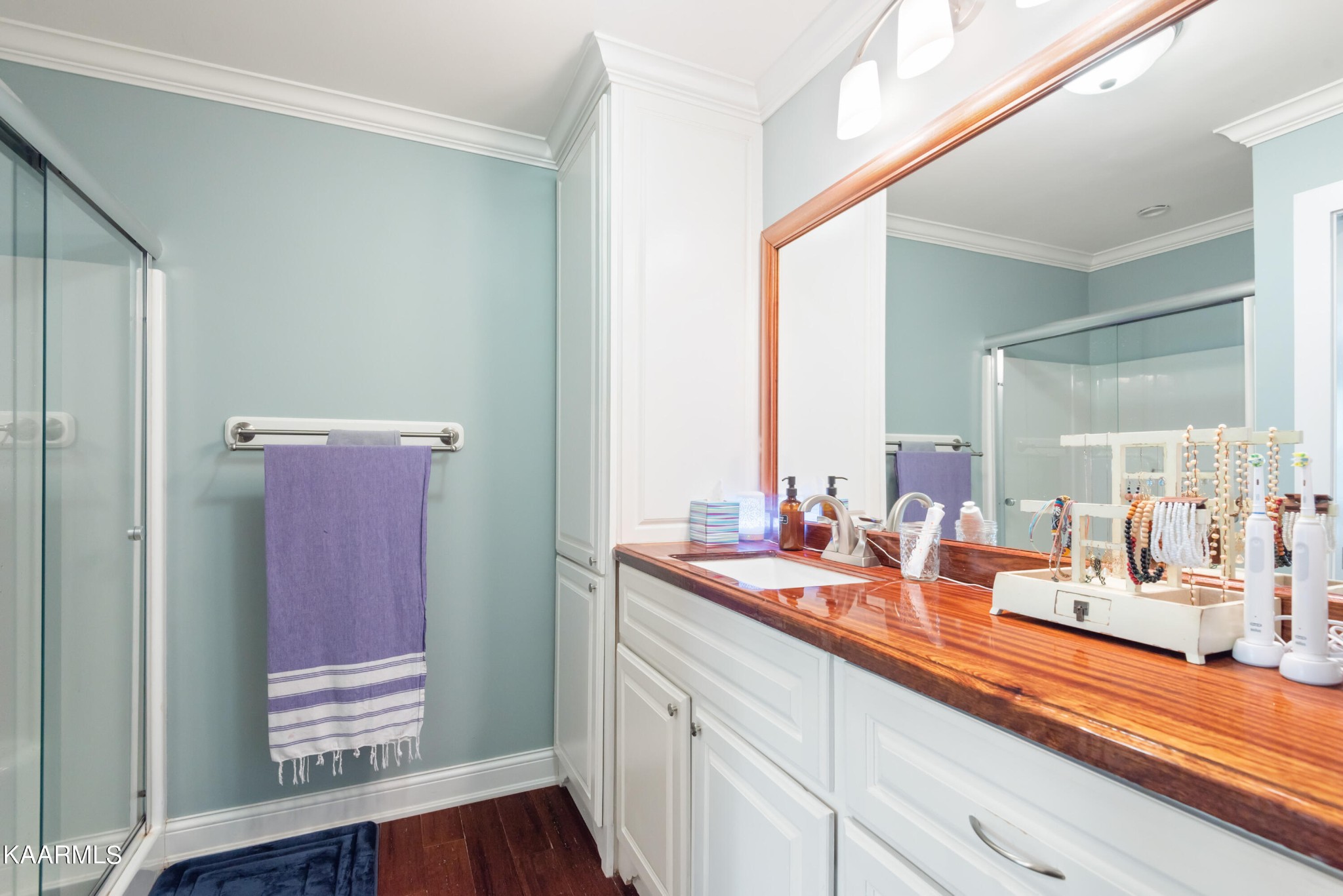 6034 Pleasant Ridge Road Knoxville, TN 37912 - Photo 15 of 40 a bathroom with a sink and a mirror